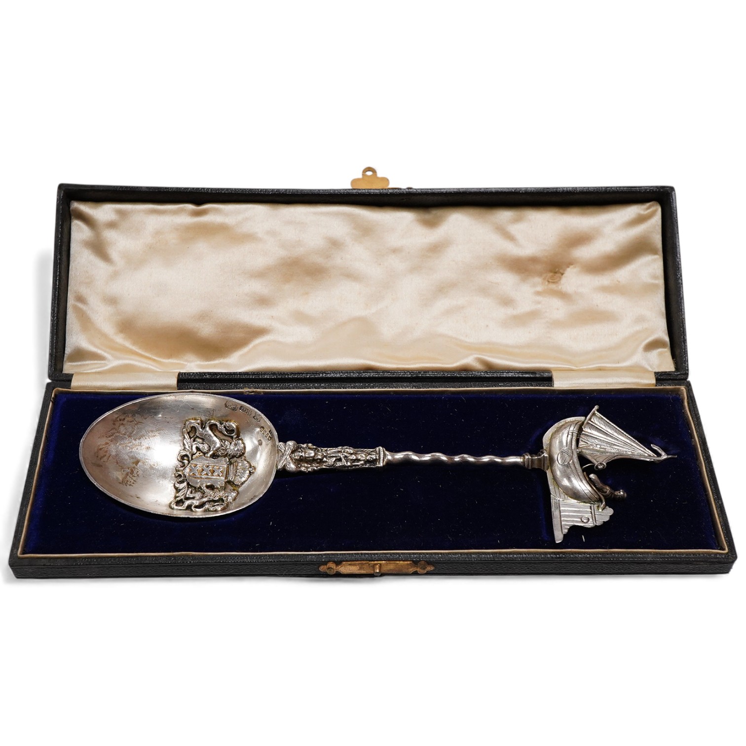 A cased Edwardian Dutch silver spoon, the bowl with applied Amsterdam City crest, the finial modelled as a yacht, import marks for Samuel Boyce Landeck, Chester, 1902, 21.7cm, 2.7oz.